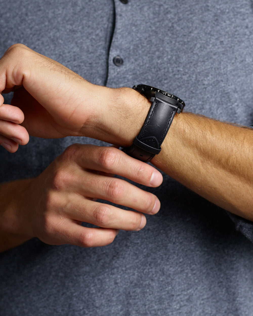 Man Wearing Black Smooth Hybrid Watch Band