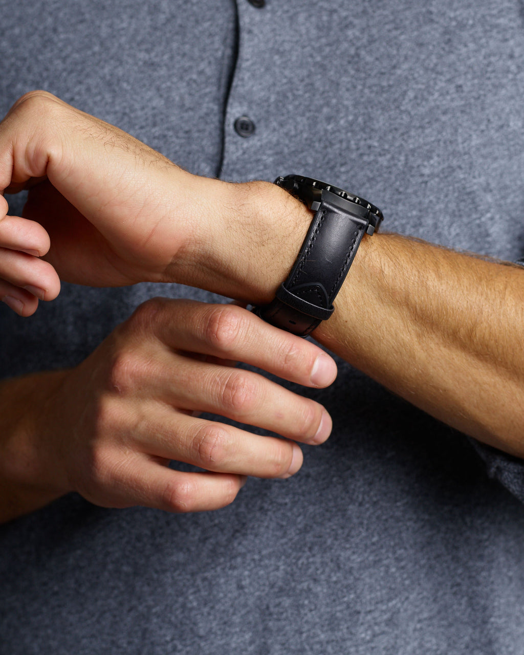 Man Wearing Black Smooth Hybrid Apple Watch Band